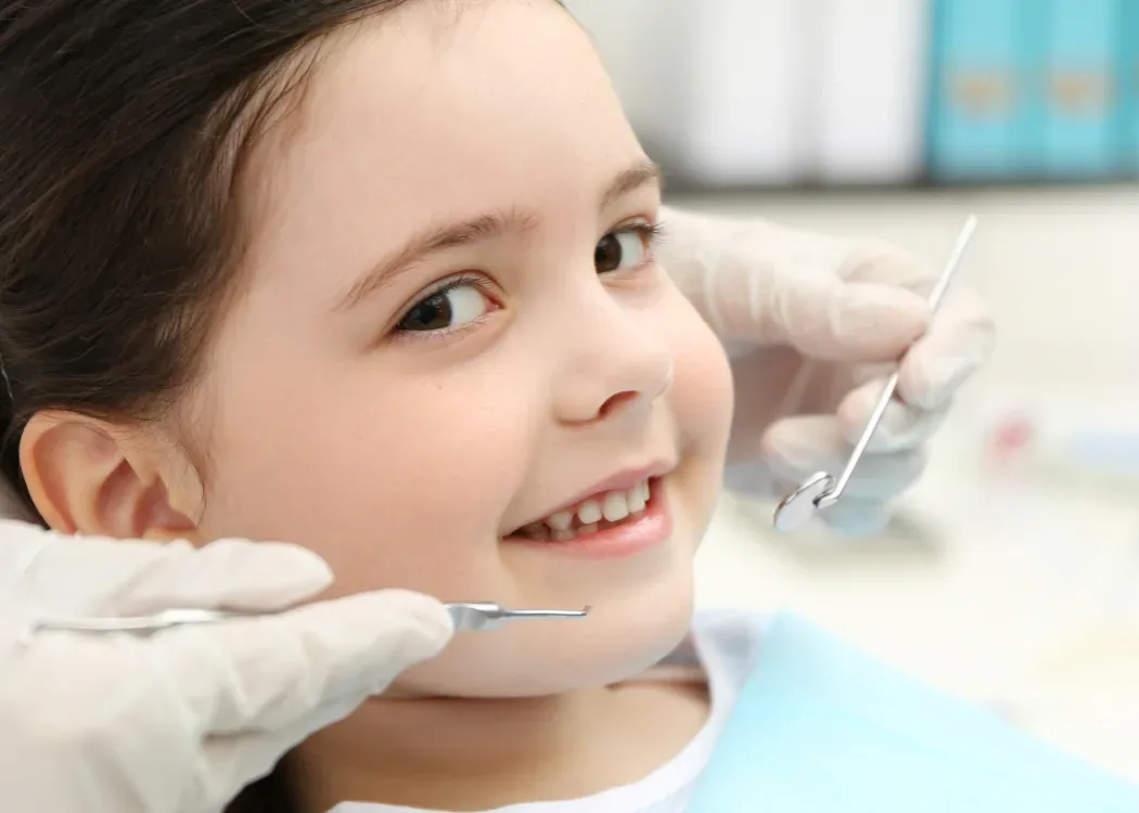 Soft healing foods like yogurt, smoothies, and mashed potatoes arranged for a child recovering after a tooth removal, Bite Squad Dental of NYC