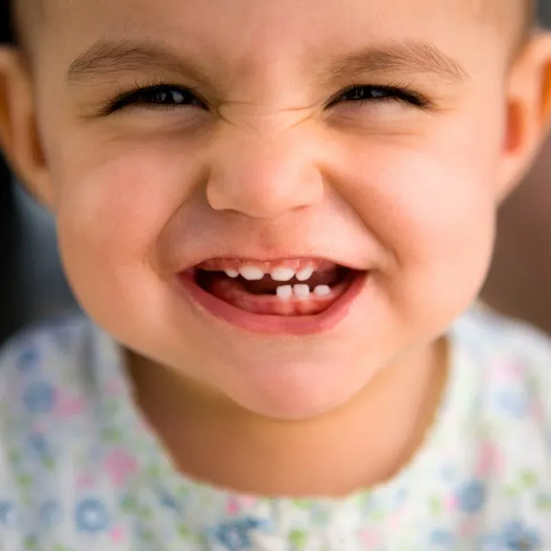 Smiling young patient during an early-detection exam at Bite Squad Dental of NYC