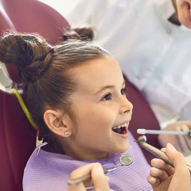 Young patient receiving protective dental sealants at Bite Squad Dental of NYC