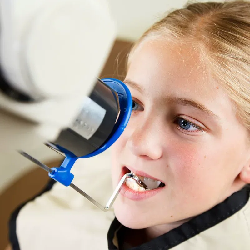 Pediatric patient having a low-radiation digital dental X-ray at Bite Squad Dental of NYC